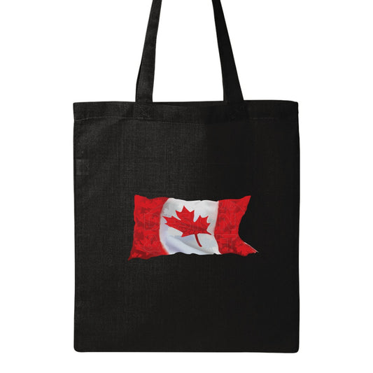 15x16" solid black canvas tote bag with A waving Canadian Flag made up of small red, white & light gray maple leaf designs